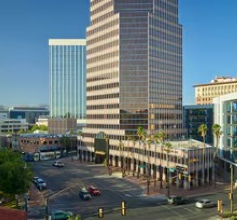 a city street with cars and buildings